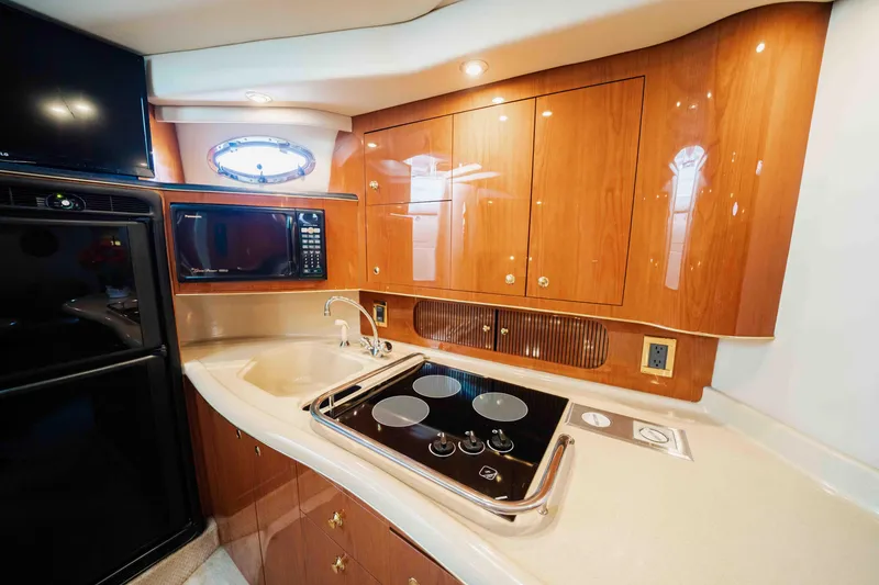 Slide: The Image of Luxurious kitchen interior of 1998 Sea Ray Sundancer 400 yacht with modern appliances. - 46