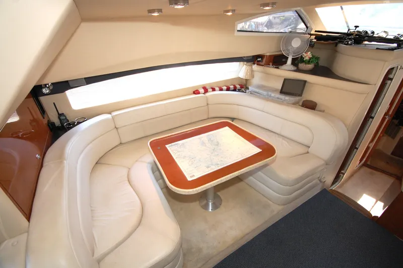 Slide: The Image of Luxurious interior of 2005 Regal Commodore 3880 yacht with plush seating and elegant table. - 17