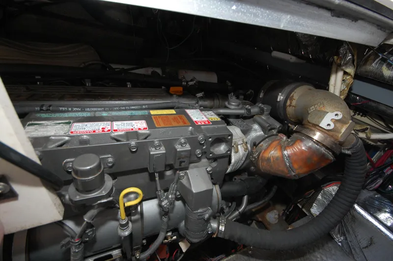 Slide: The Image of Engine compartment of a 2005 Regal Commodore 3880 boat, showcasing mechanical components. - 33
