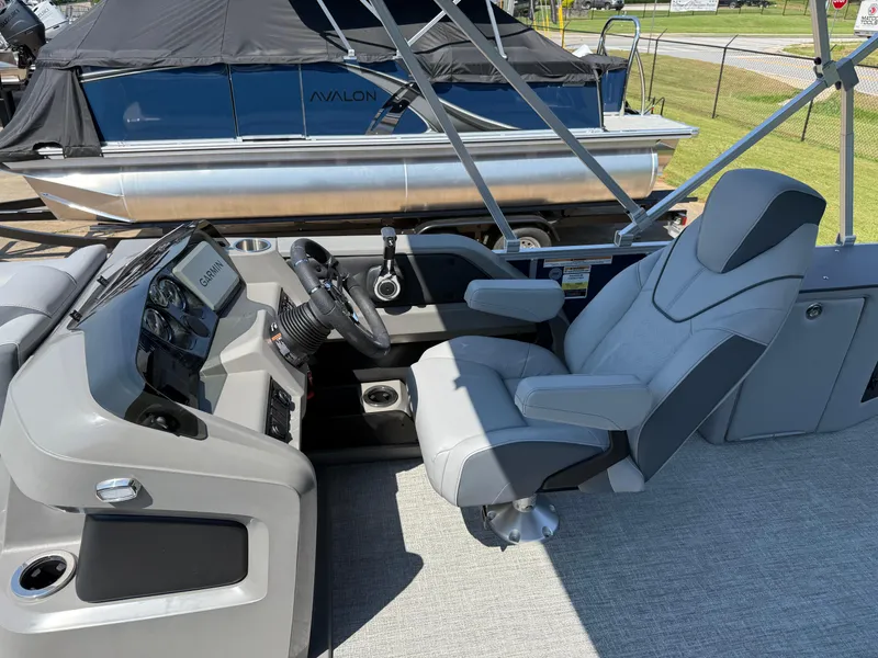 Slide: The Image of Luxurious 2025 Avalon LSZ Cruise Bench boat interior with modern helm and comfortable seating. - 13