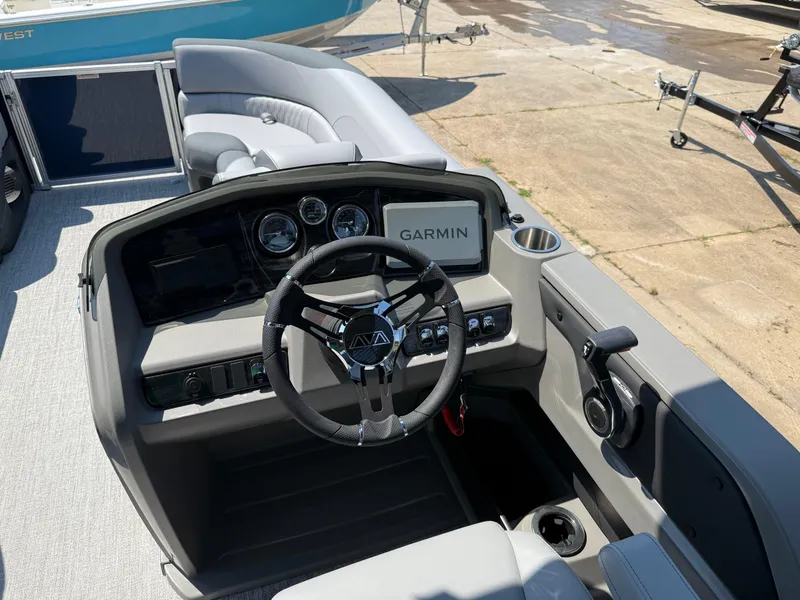 Slide: The Image of 2025 Avalon LSZ Cruise Bench boat dashboard with Garmin navigation system. - 15