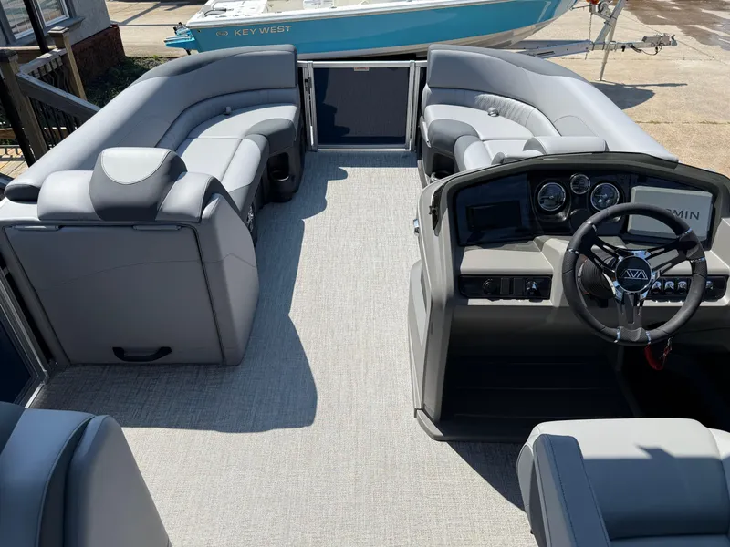 Slide: The Image of 2025 Avalon LSZ Cruise Bench interior with gray seating and modern dashboard. - 23