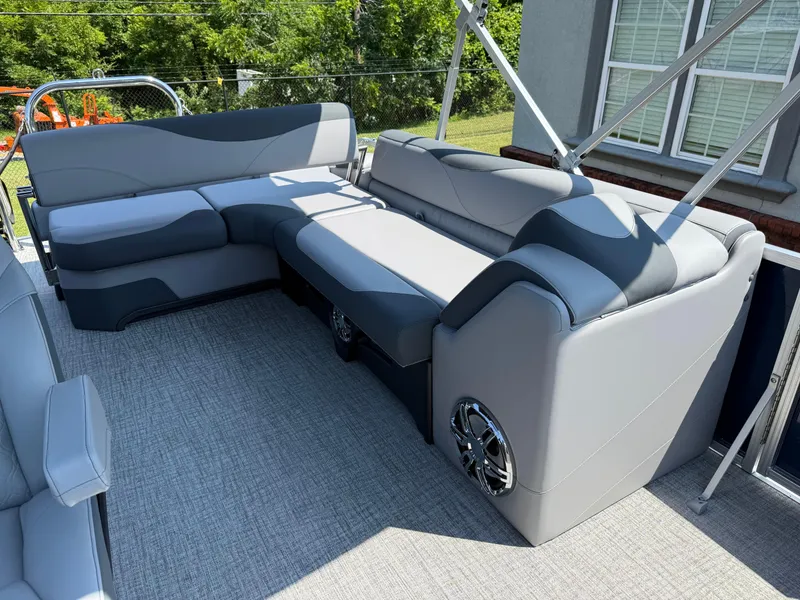 Slide: The Image of 2025 Avalon LSZ Cruise Bench with gray upholstery on a boat deck. - 27