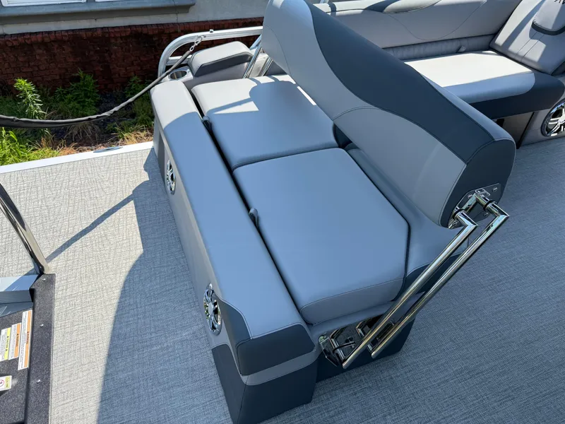 Slide: The Image of 2025 Avalon LSZ Cruise Bench with sleek gray upholstery and chrome accents on a boat deck. - 32