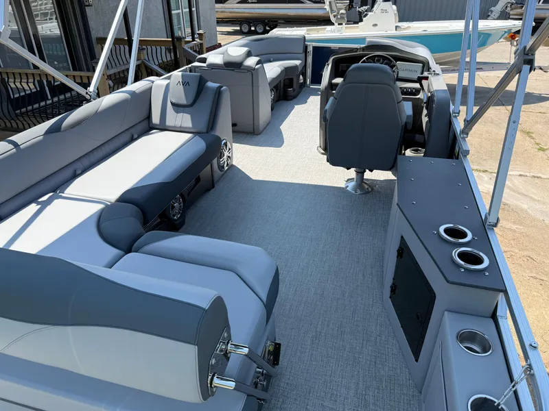 Slide: The Image of 2025 Avalon LSZ Cruise Bench boat interior with gray seating and modern dashboard. - 34