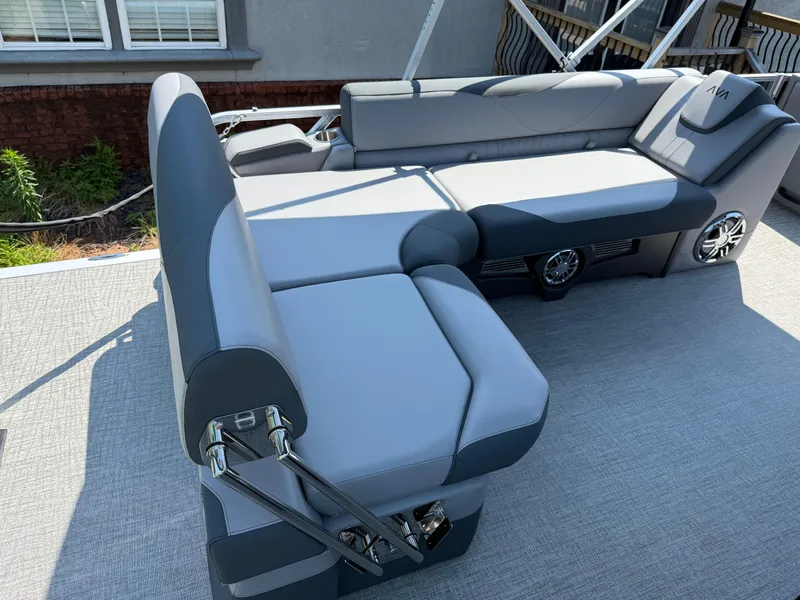 Slide: The Image of 2025 Avalon LSZ Cruise Bench with gray upholstery and integrated speakers on a boat deck. - 35