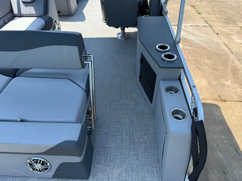 Slide: The Image of 2025 Avalon LSZ Cruise Bench interior with gray seating and cup holders on a pontoon boat. - 37