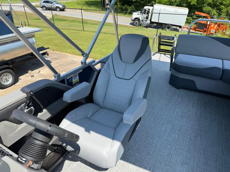 Slide: The Image of 2025 Avalon LSZ Cruise Bench boat interior with modern captain's chair and steering wheel. - 45