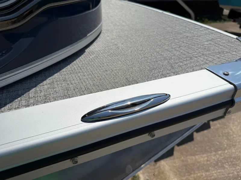 Slide: The Image of 2025 Avalon LSZ Cruise Bench boat detail with sleek design and metallic finish. - 49