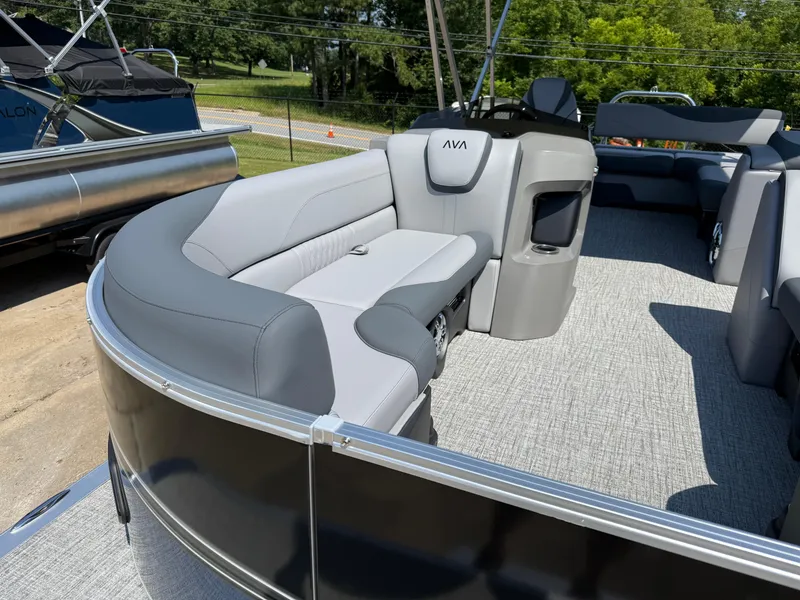 Slide: The Image of 2025 Avalon LSZ Cruise Bench pontoon boat with sleek gray seating and modern design. - 9