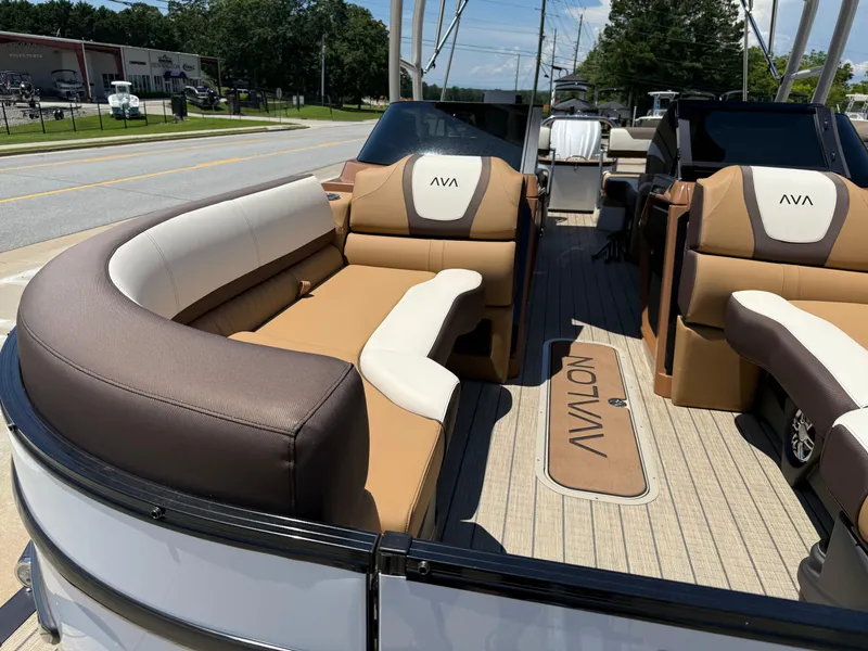 Slide: The Image of 2025 Avalon Catalina Quad Lounger Windshield boat with luxurious seating and modern design. - 11