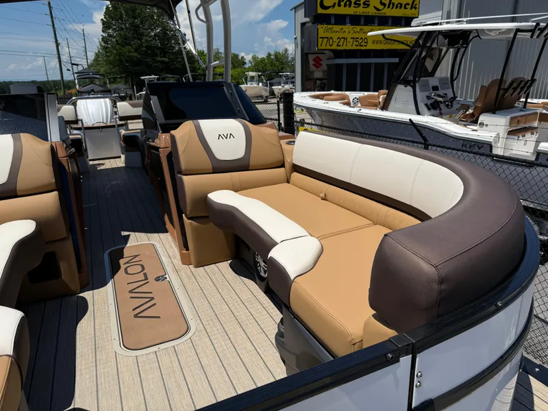 Slide: The Image of 2025 Avalon Catalina Quad Lounger Windshield boat interior with luxurious seating and modern design. - 14