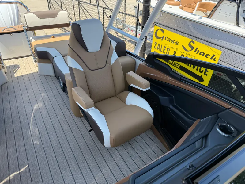 Slide: The Image of 2025 Avalon Catalina Quad Lounger Windshield boat interior with luxurious seating and modern design. - 21