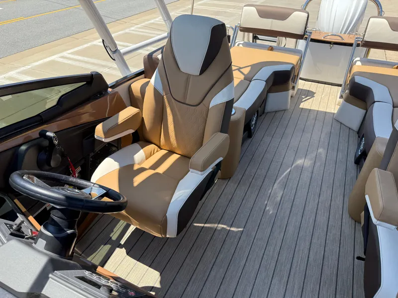 Slide: The Image of 2025 Avalon Catalina Quad Lounger Windshield interior with luxurious seating and steering wheel. - 22