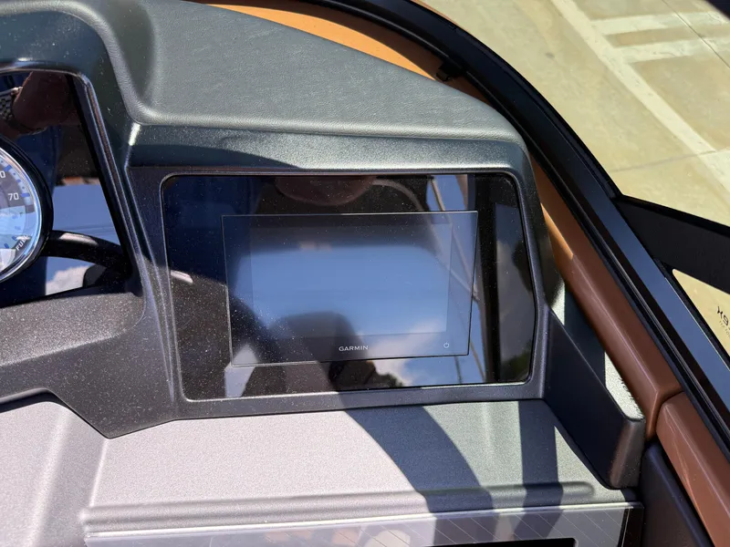 Slide: The Image of Dashboard of 2025 Avalon Catalina Quad Lounger Windshield with Garmin display. - 26