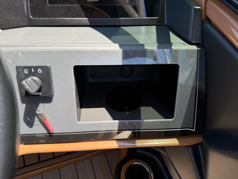 Slide: The Image of Dashboard of 2025 Avalon Catalina Quad Lounger Windshield with ignition and storage compartment. - 27