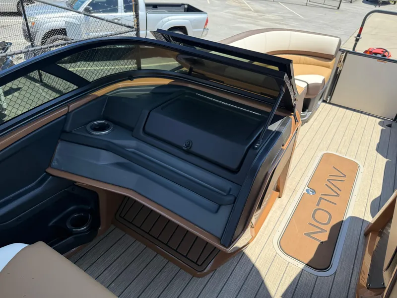 Slide: The Image of 2025 Avalon Catalina Quad Lounger Windshield interior with seating and deck details. - 29