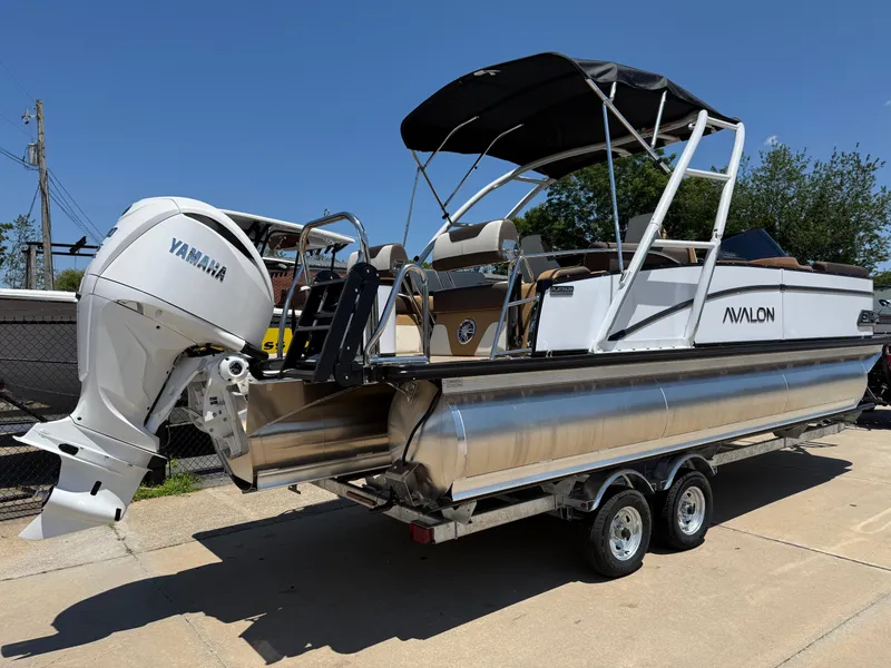 Slide: The Image of 2025 Avalon Catalina Quad Lounger Windshield pontoon boat with Yamaha outboard motor on trailer. - 4