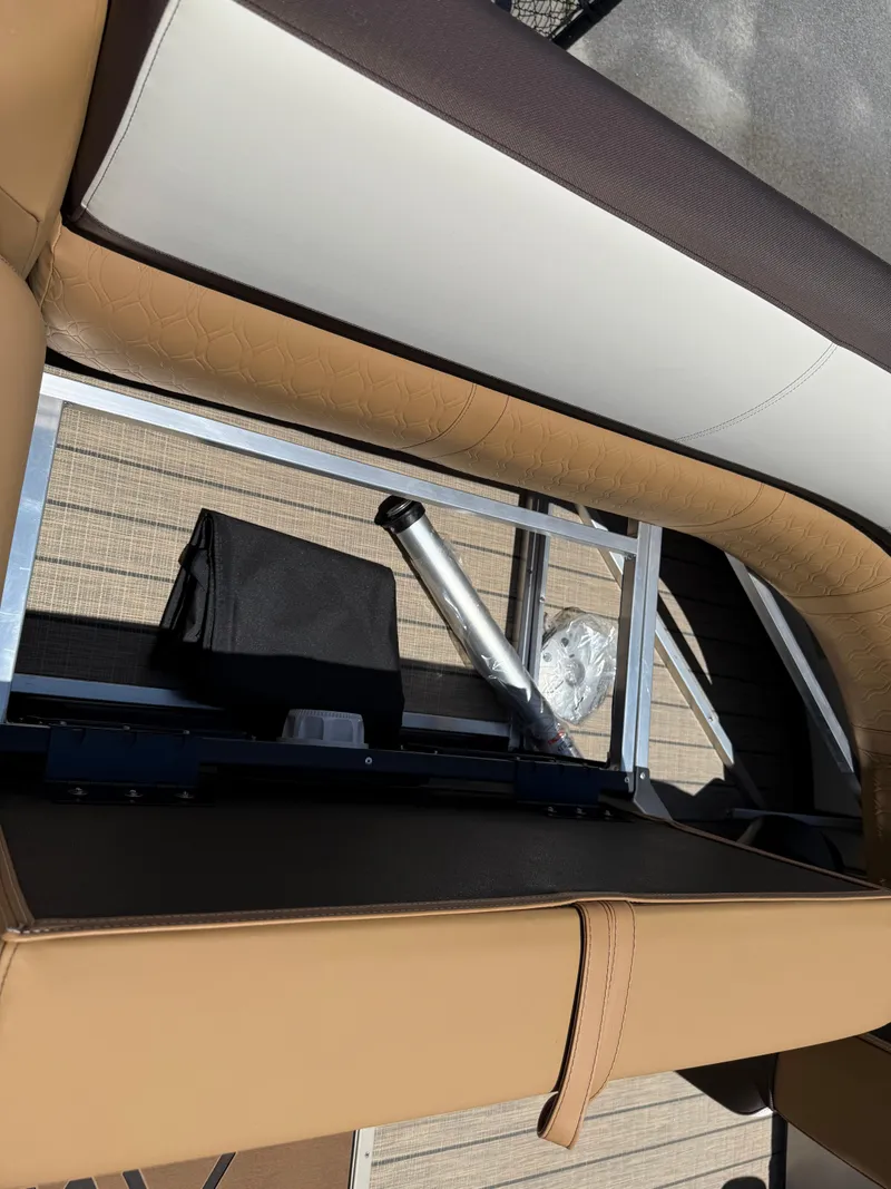 Slide: The Image of 2025 Avalon Catalina Quad Lounger Windshield interior seating with storage compartment. - 45