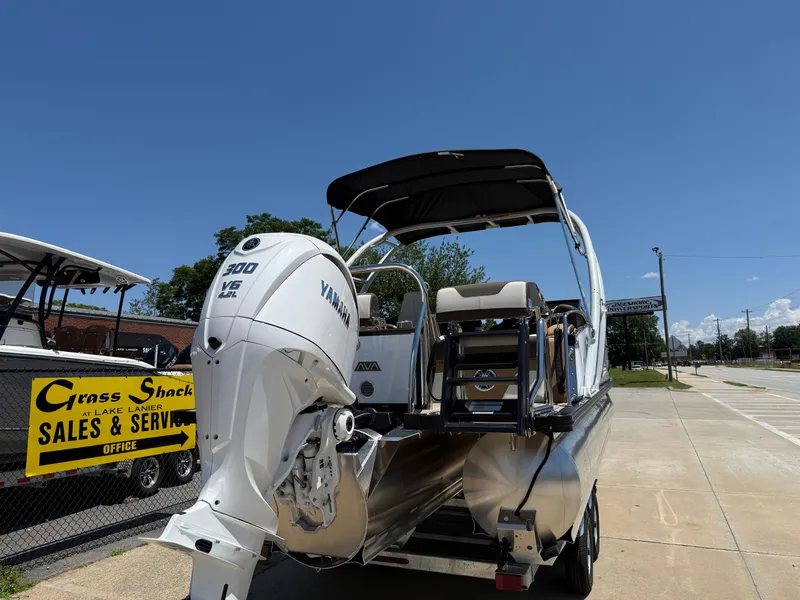 Slide: The Image of 2025 Avalon Catalina Quad Lounger Windshield with Yamaha 300 V6 engine, parked outdoors. - 5
