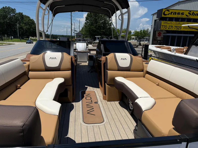 Slide: The Image of 2025 Avalon Catalina Quad Lounger Windshield boat with luxurious seating and modern design. - 8