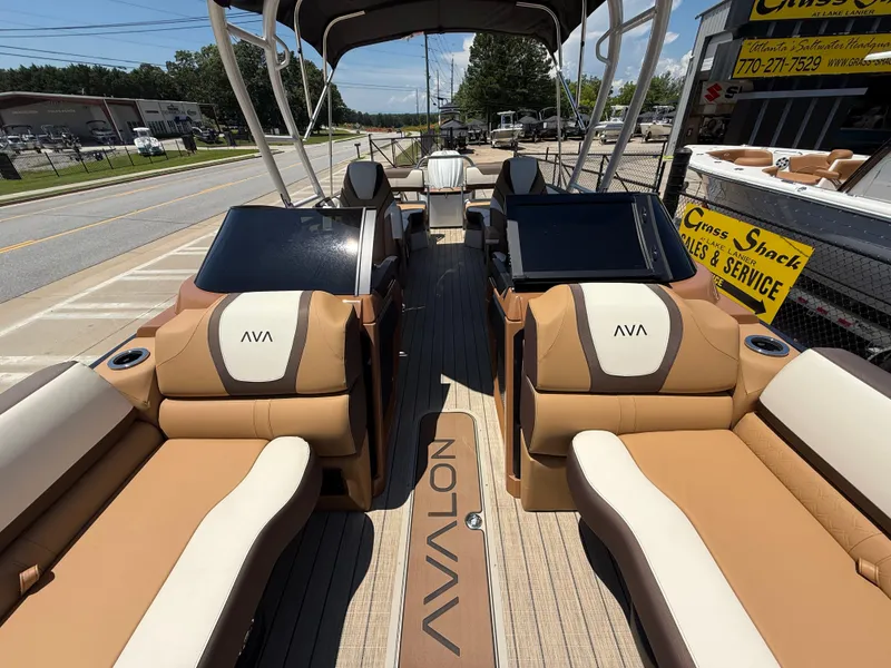 Slide: The Image of 2025 Avalon Catalina Quad Lounger Windshield boat interior with luxurious seating and modern design. - 9