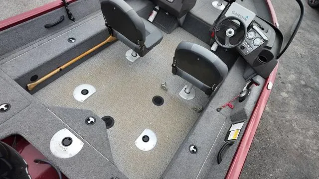 Slide: The Image of 2023 Tracker Pro Guide™ V-16 SC boat interior with seating and steering console. - 14