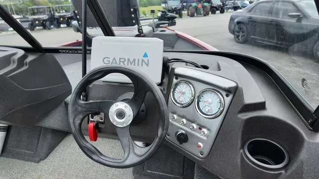 Slide: The Image of 2023 Tracker Pro Guide V-16 SC boat dashboard with Garmin GPS and gauges. - 16