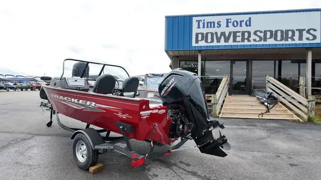 Slide: The Image of 2023 Tracker Pro Guide V-16 SC boat displayed at Tims Ford Powersports dealership. - 3