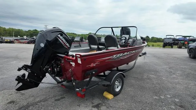 Slide: The Image of 2023 Tracker Pro Guide V-16 SC boat with Mercury engine on a trailer. - 5