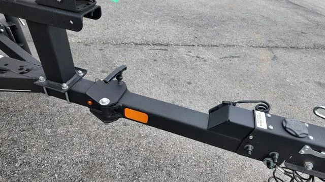 Slide: The Image of Trailer hitch of 2023 Tracker Pro Guide™ V-16 SC on asphalt surface. - 8