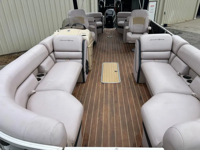 Slide: The Image of 2017 South Bay 525 RS Arch 3.0+ pontoon boat with spacious seating and wood-style flooring. - 10