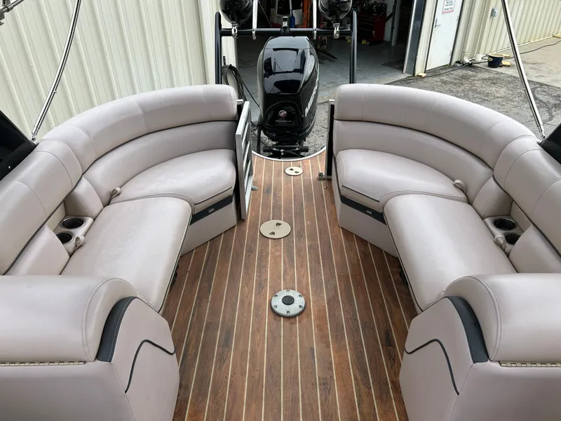 Slide: The Image of Luxurious 2017 South Bay 525 RS Arch 3.0+ pontoon boat interior with plush seating and wood flooring. - 11