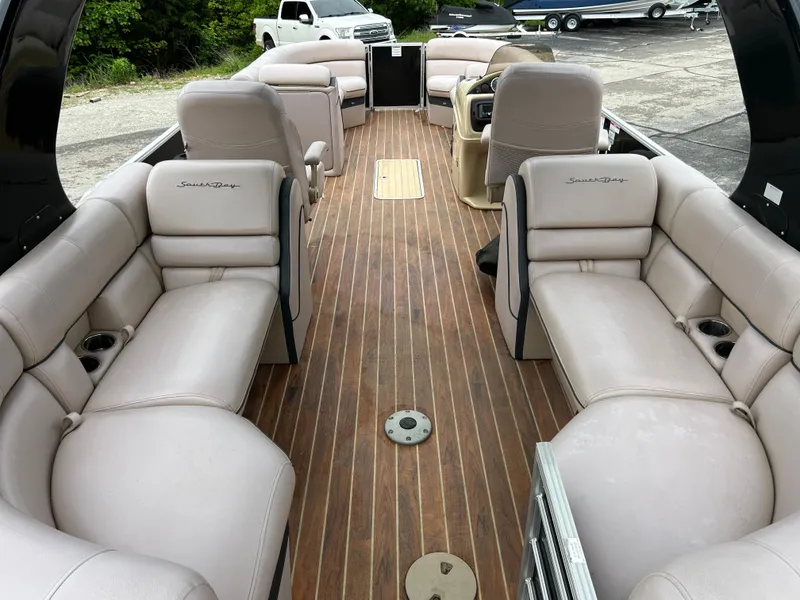 Slide: The Image of 2017 South Bay 525 RS Arch 3.0+ pontoon boat with spacious seating and wood-style flooring. - 6