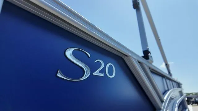Slide: The Image of 2025 Bennington 20 SF Fish boat, blue exterior with "S20" emblem. - 10