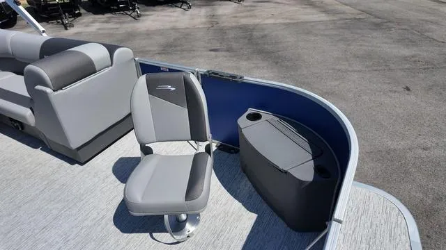 Slide: The Image of 2025 Bennington 20 SF Fish boat interior with gray seating and storage compartment. - 13