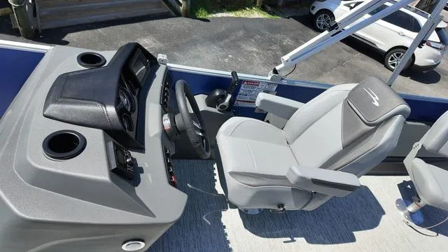 Slide: The Image of 2025 Bennington 20 SF Fish boat interior with steering console and captain's chair. - 22