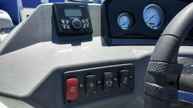 Slide: The Image of Control panel of 2025 Bennington 20 SF Fish boat with gauges and switches. - 25
