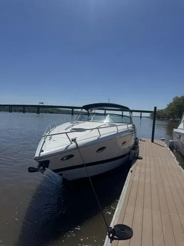 Slide: The Image of 2003 Cobalt 360 boat docked on a sunny day by a river. - 4