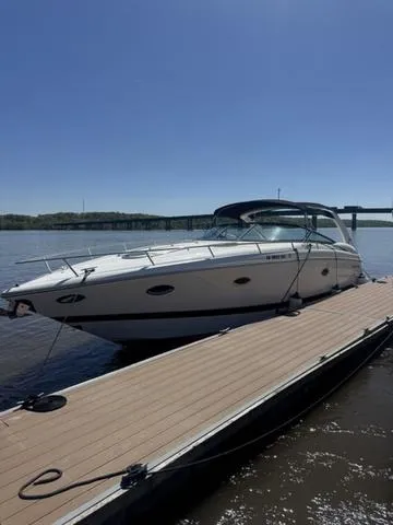Slide: The Image of 2003 Cobalt 360 boat docked on a sunny day with clear blue sky. - 8