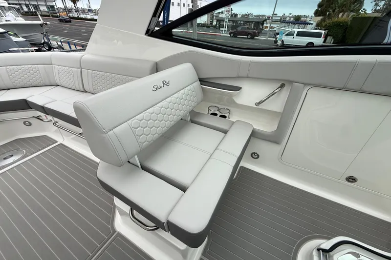 Slide: The Image of 2026 Sea Ray Sundancer 320 interior with luxurious seating and modern design. - 12