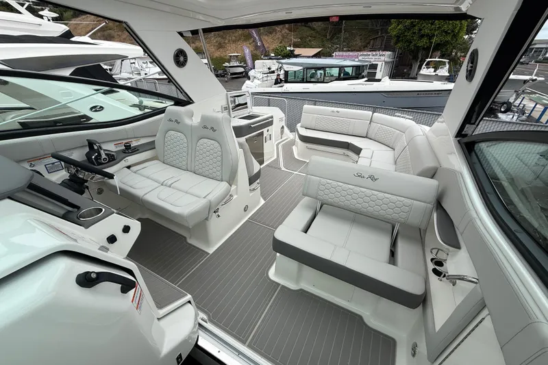 Slide: The Image of Luxurious interior of 2026 Sea Ray Sundancer 320 yacht with elegant seating and modern design. - 13