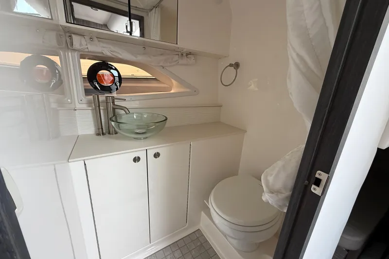 Slide: The Image of Modern bathroom in 2026 Sea Ray Sundancer 320 yacht with glass sink and compact design. - 20