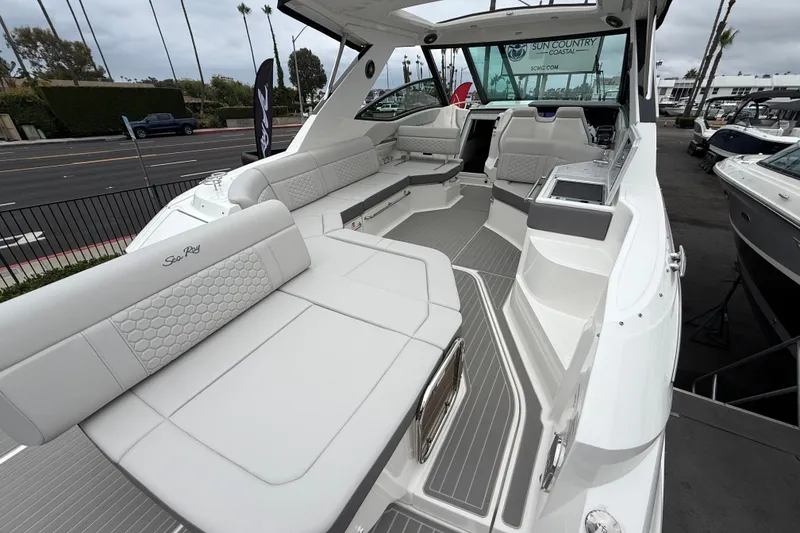Slide: The Image of 2026 Sea Ray Sundancer 320 boat interior with luxurious seating and modern design. - 4