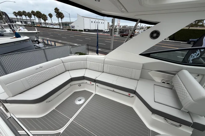 Slide: The Image of Luxurious seating area on 2026 Sea Ray Sundancer 320 yacht, featuring modern design and comfort. - 6