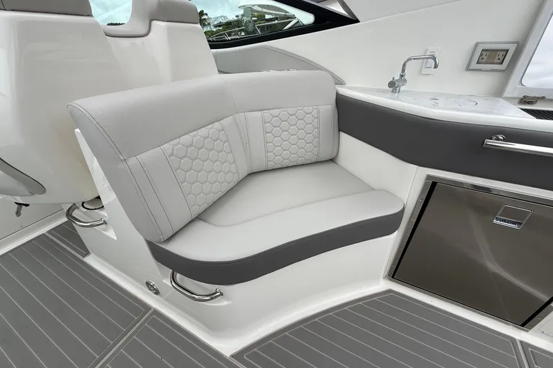Slide: The Image of Luxurious seating area on 2026 Sea Ray Sundancer 320 yacht with modern design. - 8