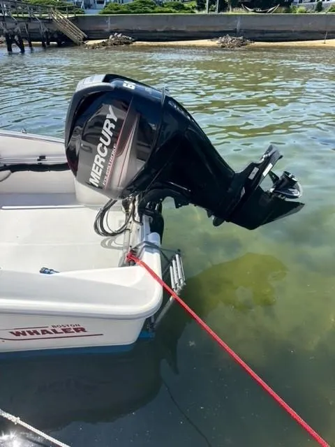 Slide: The Image of 2016 Boston Whaler 150 Super Sport with Mercury outboard motor in shallow water. - 8