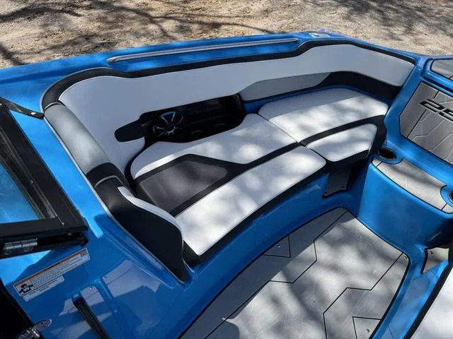 Slide: The Image of 2022 Yamaha Boats 255XD interior with blue and white seating, modern design. - 10