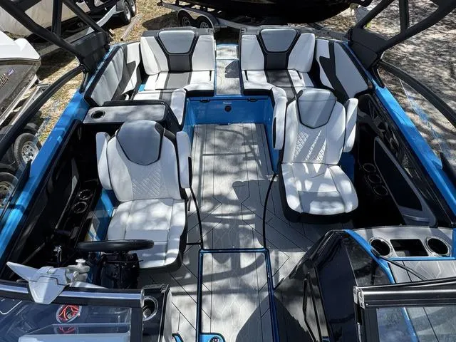 Slide: The Image of 2022 Yamaha Boats 255XD interior with modern seating and sleek design. - 14