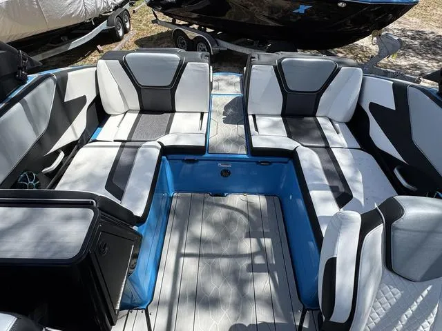 Slide: The Image of 2022 Yamaha Boats 255XD interior with sleek seating and modern design. - 18